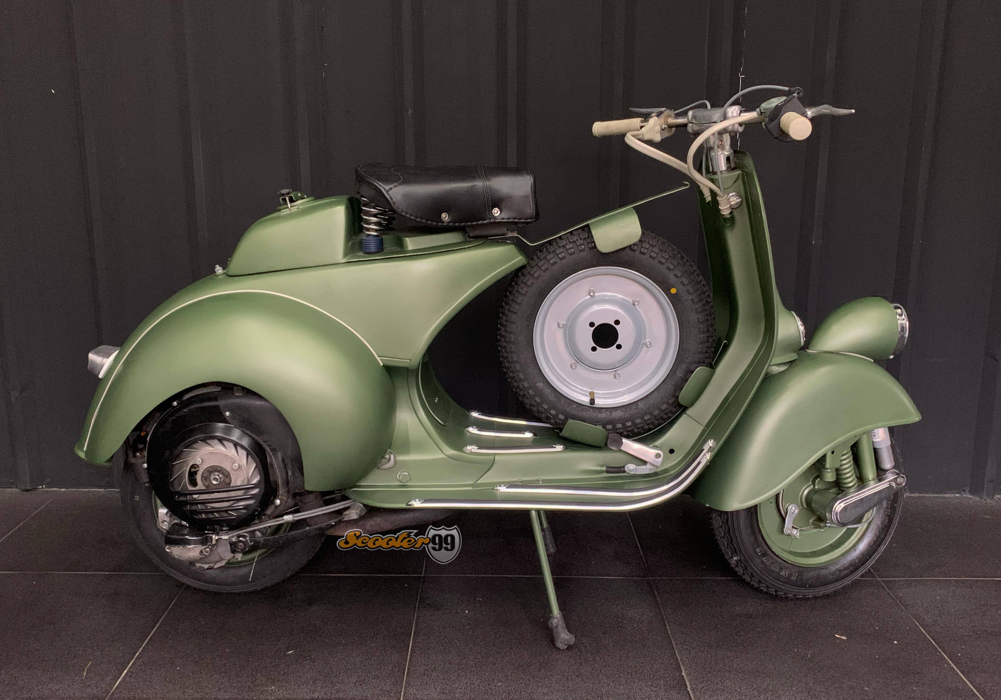 Side profile of Vespa Sei Giorni 150 with spare wheel on leg shield